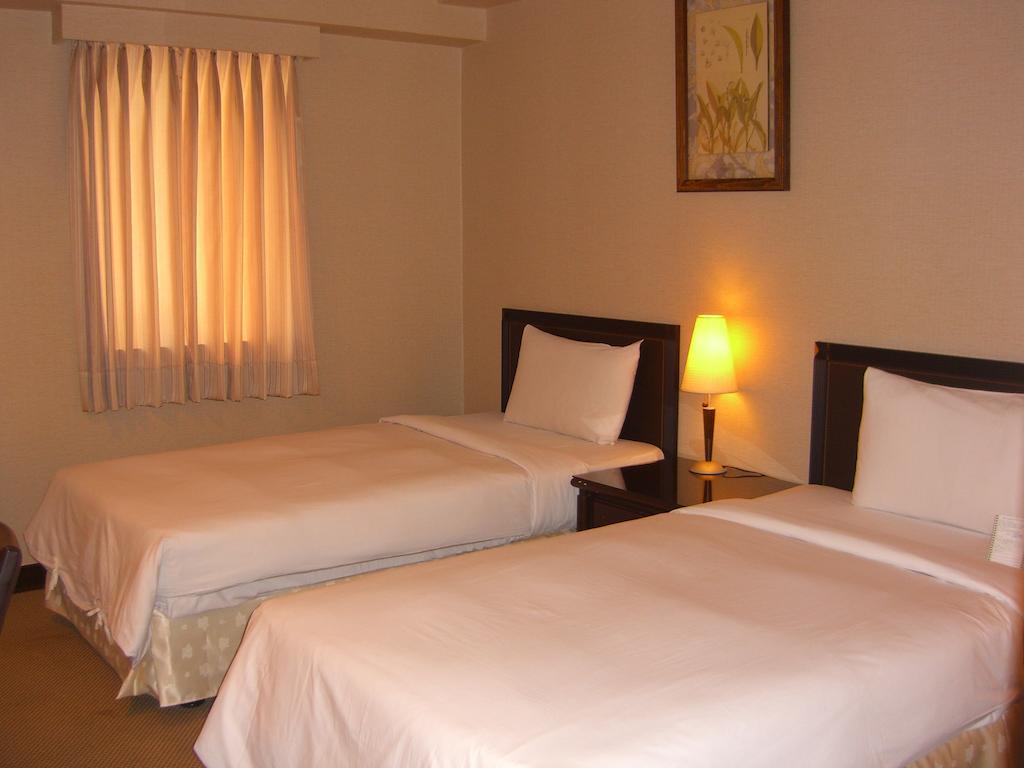 Lincoln Hotel Тайнань Номер фото